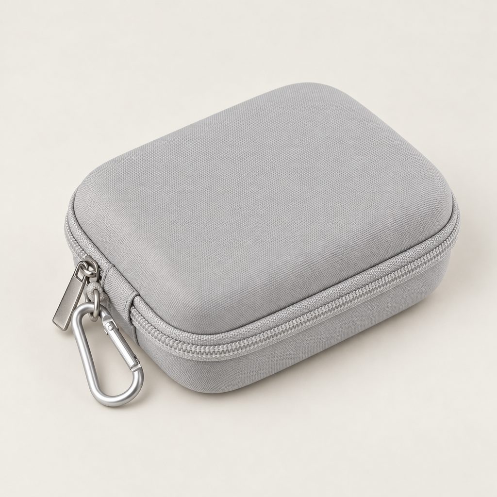 Grey hard case, zipped shut, with its metal clip